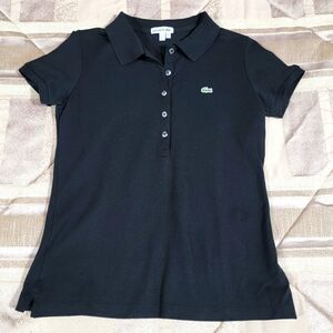 Ladies Lacoste Polo top. Pique knit. Very fitted. Size 38.